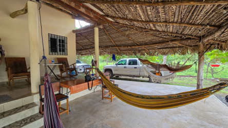 Large rustic tropical porch with garden and seating in Playa La Colorada house