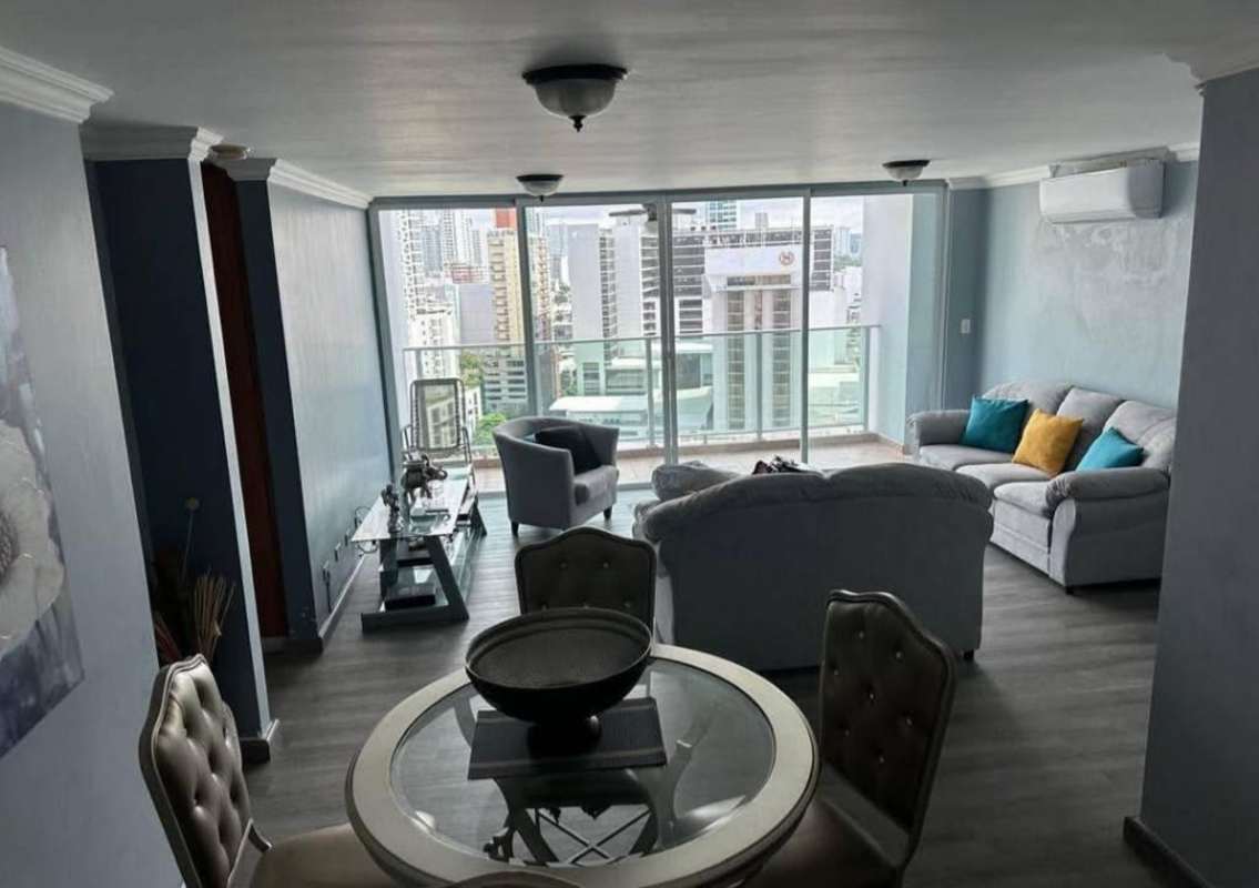 Bright living and dining space with large windows and city views in PH Terramar Panama City condo for rent