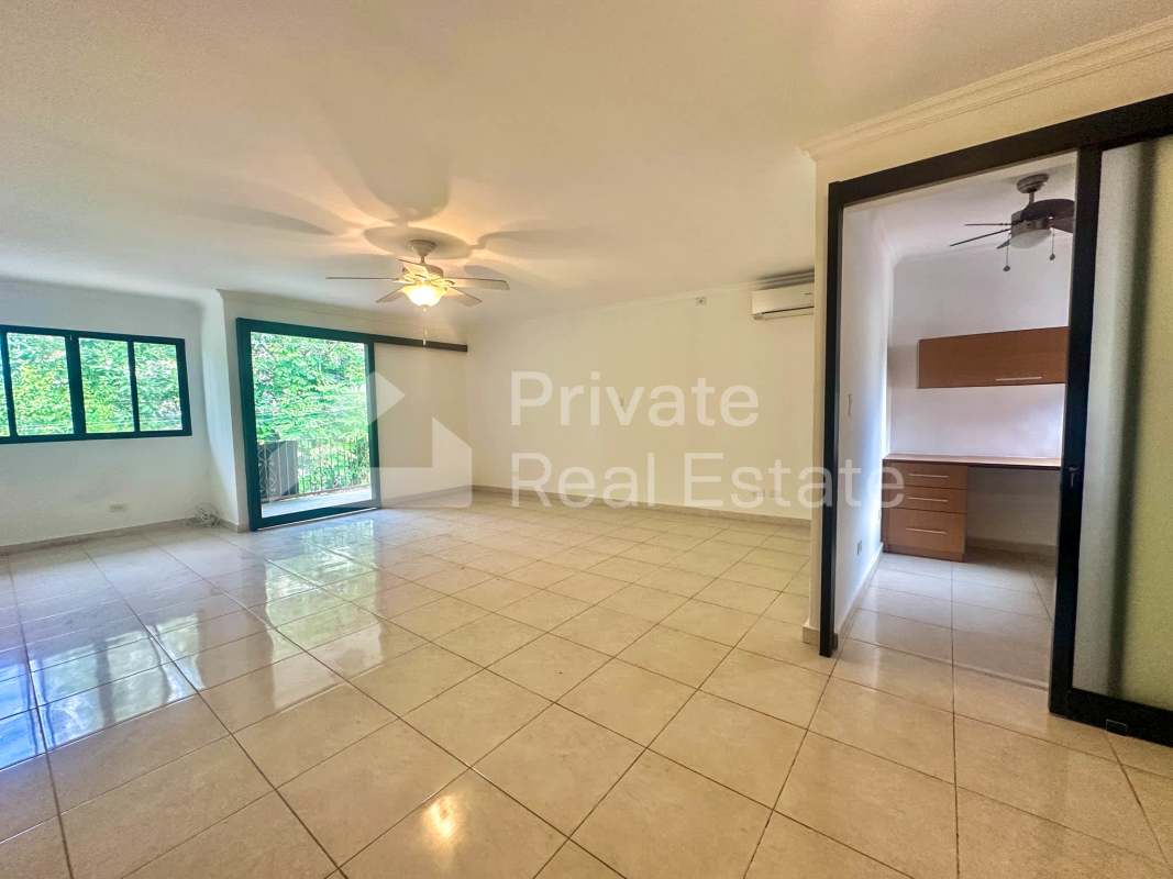 Bedroom featuring built-in closets ceiling fan AC in remodeled Punta Paitilla home Panama
