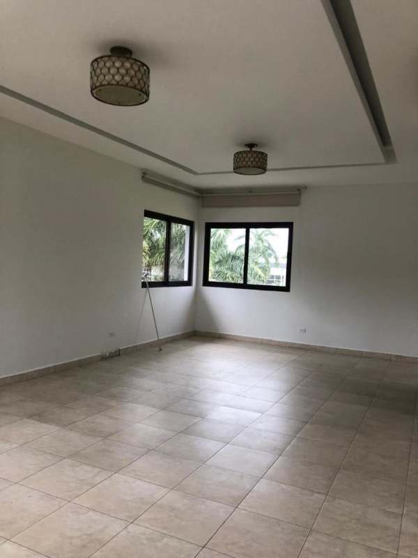 Second spacious living room with tile floors, large windows and natural light Costa del Este luxury house Panama