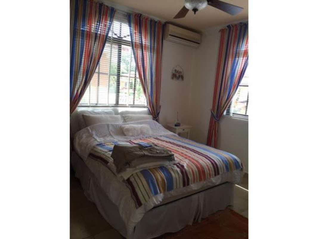 Outdoor patio with hammock, plants, and tiled flooring in Clayton Village Panama