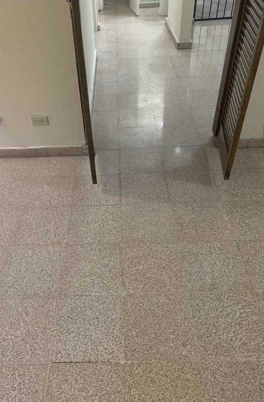 Empty bedroom with barred window exposed beams in apartment for sale La Loceria Panama