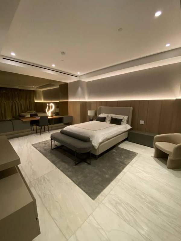 Spacious bedroom with floor-to-ceiling windows and elegant designer finishes at PH La Maison Santa María