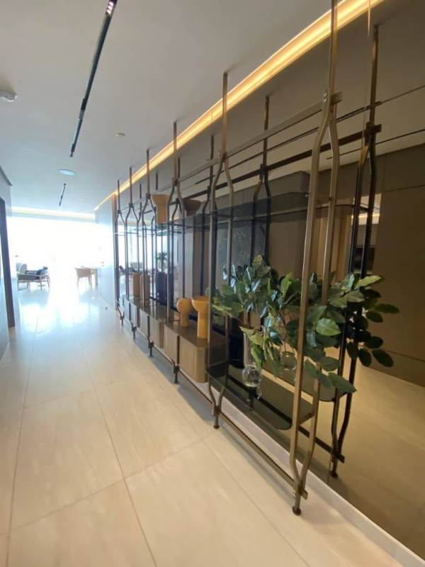 Modern luxury hallway with decorative divider and marble flooring at PH La Maison by Fendi Casa Panama
