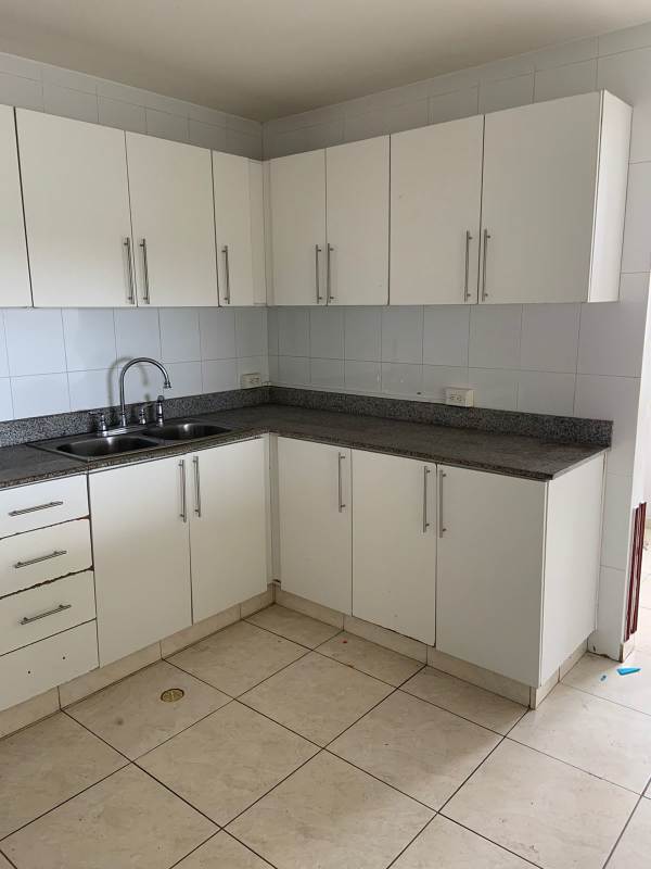 Bedroom with large windows and city view in PH Hyde Park Panama