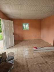 Unfurnished living room with tiled floor in rustic house Las Tablas Panama
