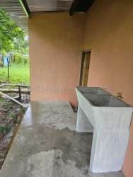 Simple rural bathroom with walk-in shower and peach walls