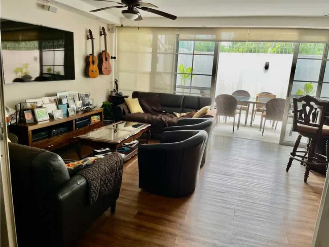 Bright living room with large windows, ceiling fan in Altos del Golf luxury house Panama City