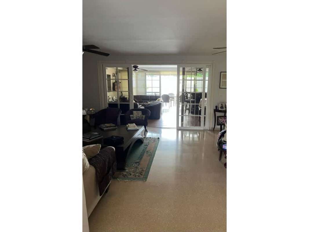 Open-plan living with terrace access in luxury Altos del Golf Panama home