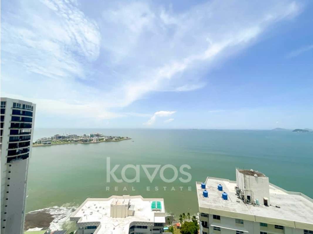 Modern living area with large panoramic windows facing the ocean in The Towers Paitilla Panama