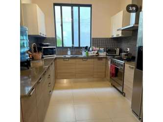 Modern kitchen with granite countertops and stainless appliances townhouse in Panama Pacifico