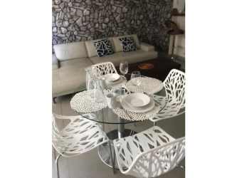 Resort-style swimming pool surrounded by palm trees in PH Mosaic Panama Pacifico