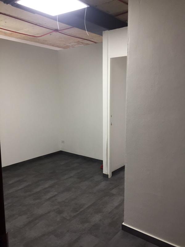 Modern minimalist office corridor with glass walls in PH BICSA Tower Panama