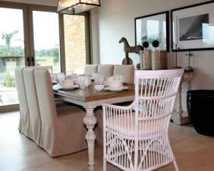 Modern dining space with direct ocean view windows in Caribbean beachfront apartment Playa Escondida Resort Panama