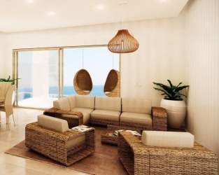 Open-concept living room in beachfront apartment with panoramic ocean view at Playa Escondida Resort Colón Panama