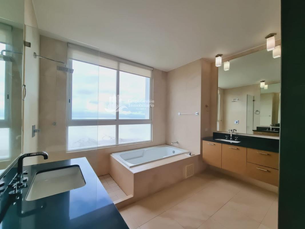 Master bedroom featuring walk-in closet, floor-to-ceiling windows with ocean view, ensuite bath PH Acqua Costa del Este Panama