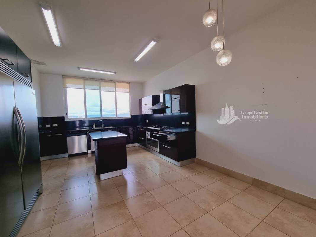 Spacious luxury kitchen with granite countertops, center island, stainless appliances in PH Acqua Costa del Este Panama