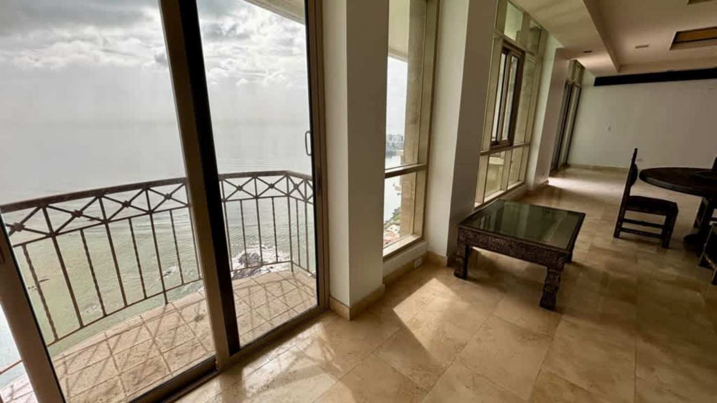Large bedroom with corner windows, wood floor, city skyline view, Pacific Point Punta Pacifica