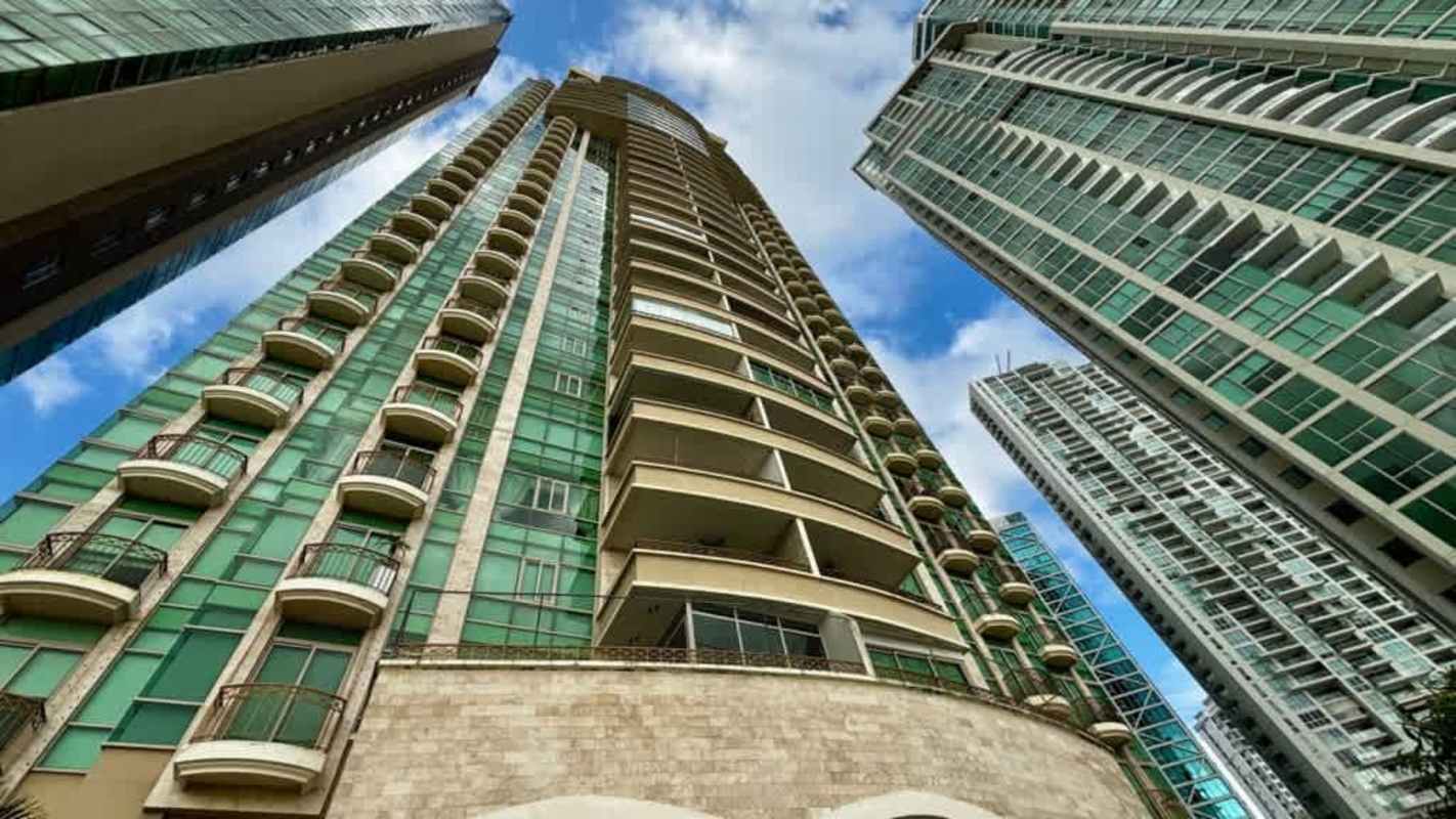 Elegant living dining space with large windows leading to oceanview balcony Punta Pacifica