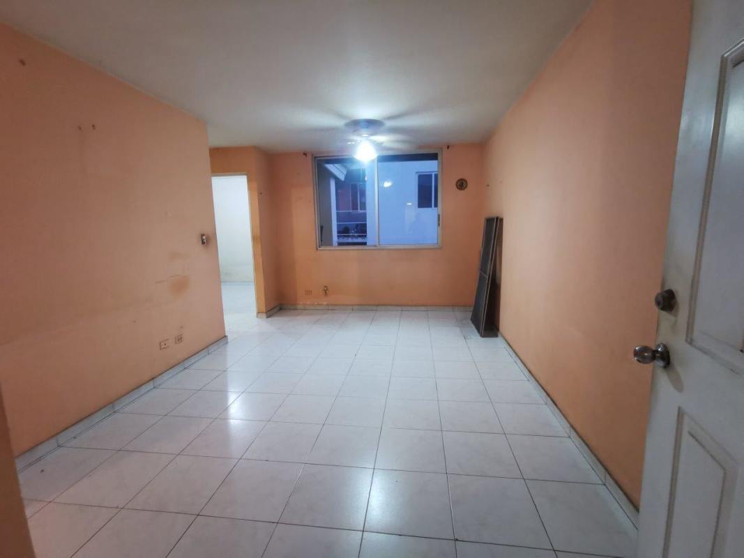 Basic galley kitchen with tile backsplash cabinets at Villa Margarita apartment in Panama City