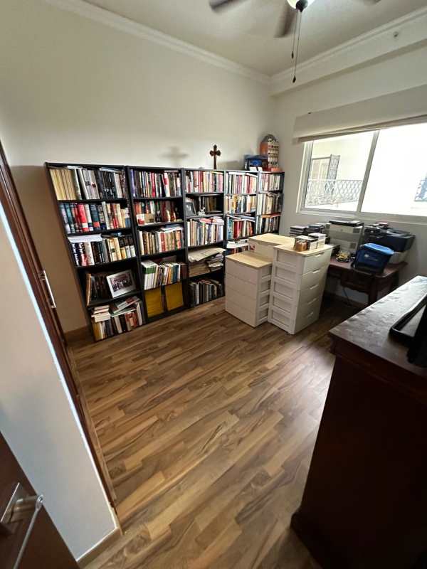 Bedroom with wood floors, sliding door leading to balcony with golf course view in PH The Reserve Santa María Panama