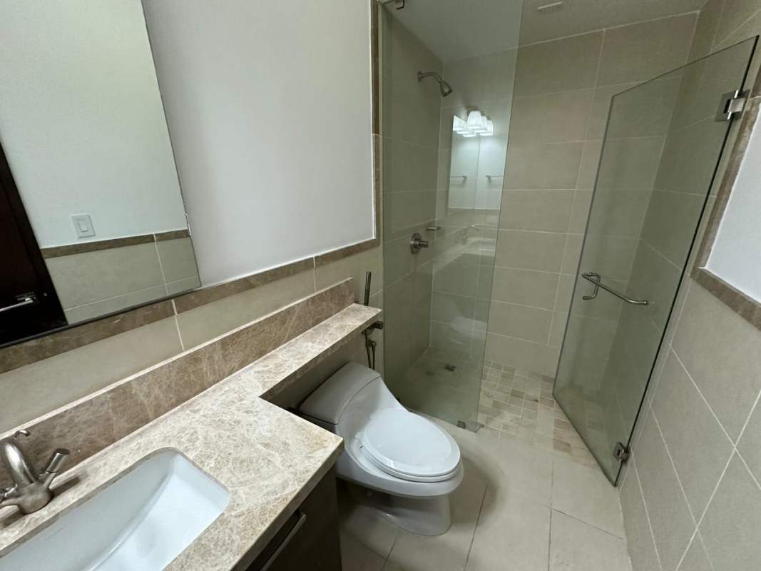 Spacious bedroom closet with built-in shelves, minimalist design, PH The Reserve Panama