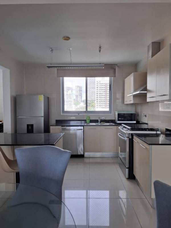 Contemporary kitchen with large window and city views at PH Allure at the Park Panama City