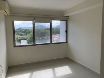 Bright bedroom with large windows and mountain views at PH Midrise Panama Pacifico