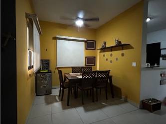 Spacious living room with large windows and tile floors at Woodlands house Panama Pacifico