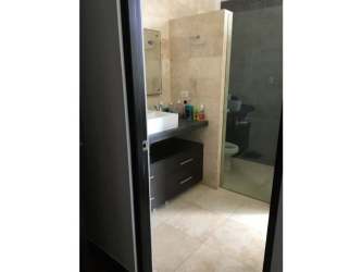 Contemporary tiled bathroom with walk-in shower and vanity at PH Rio Mar San Carlos Panama