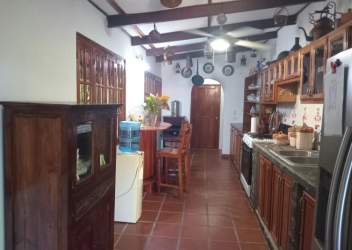 Wooden beachfront deck terrace with ocean views and lush tropical greenery at Playa Corona Panama