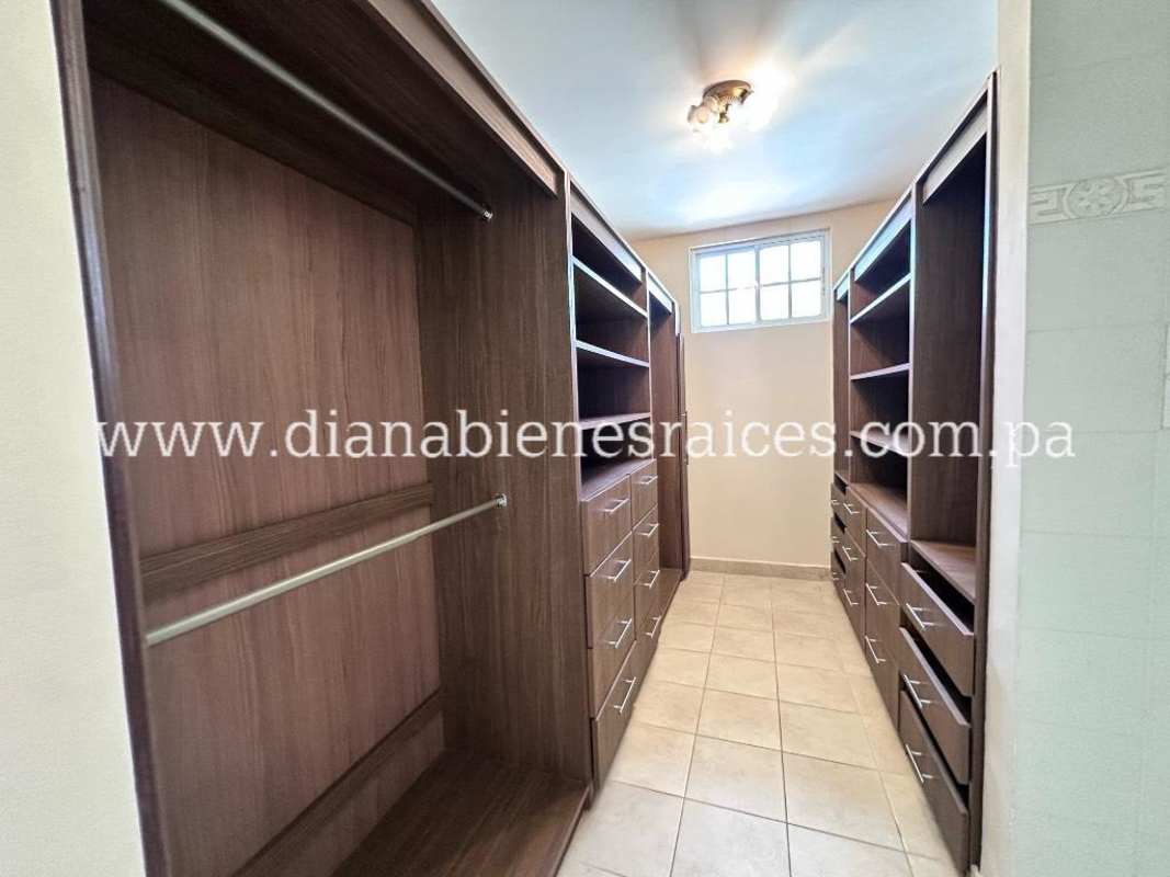 Dining space with large windows overlooking inner garden in Clayton rental house