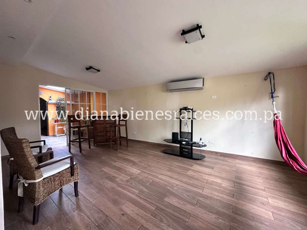 Kitchen with granite counters, wooden cabinets, refrigerator and stove in Clayton rental house