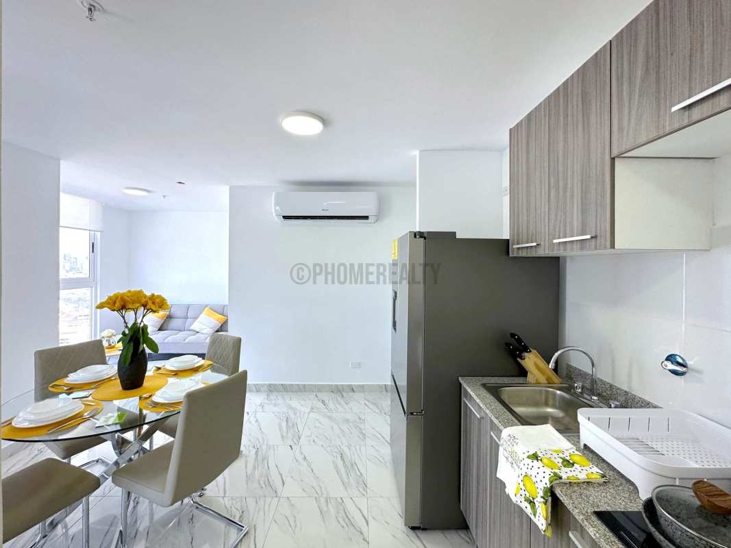Compact modern kitchen dining area with ceramic floors at PH The Sands on Avenida Balboa