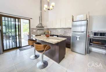High ceiling living room with arched windows and open layout in El Valle Panama