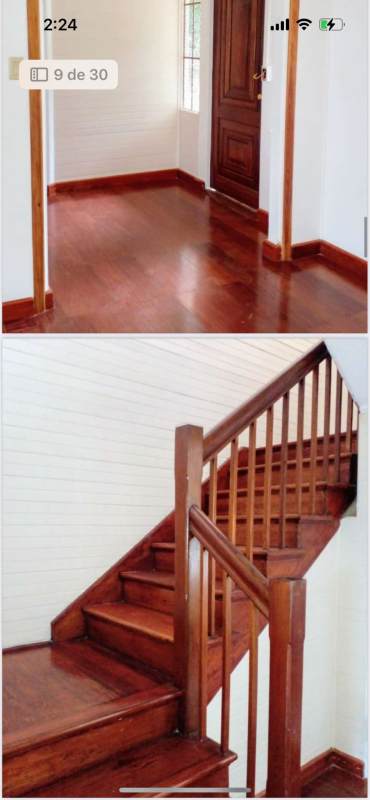 Large living room with wood floors, bright windows in Ancón duplex Panama