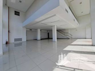 Glass storefront facade with large parking Plaza Costa Verde La Chorrera