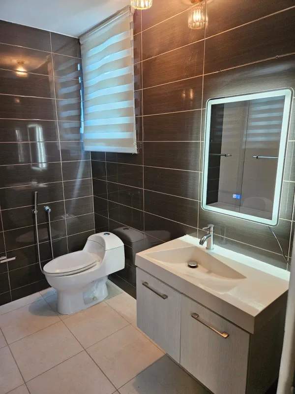 Stylish bathroom with modern vanity backlit mirror PH Miro Vía Argentina Panama