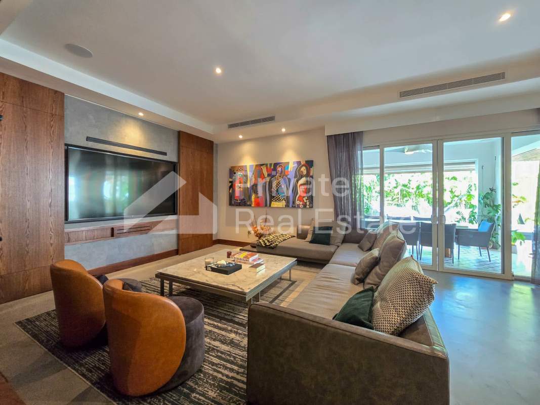 Large open living and TV area with modern finishes in luxury villa Santa Maria Crescent Lane