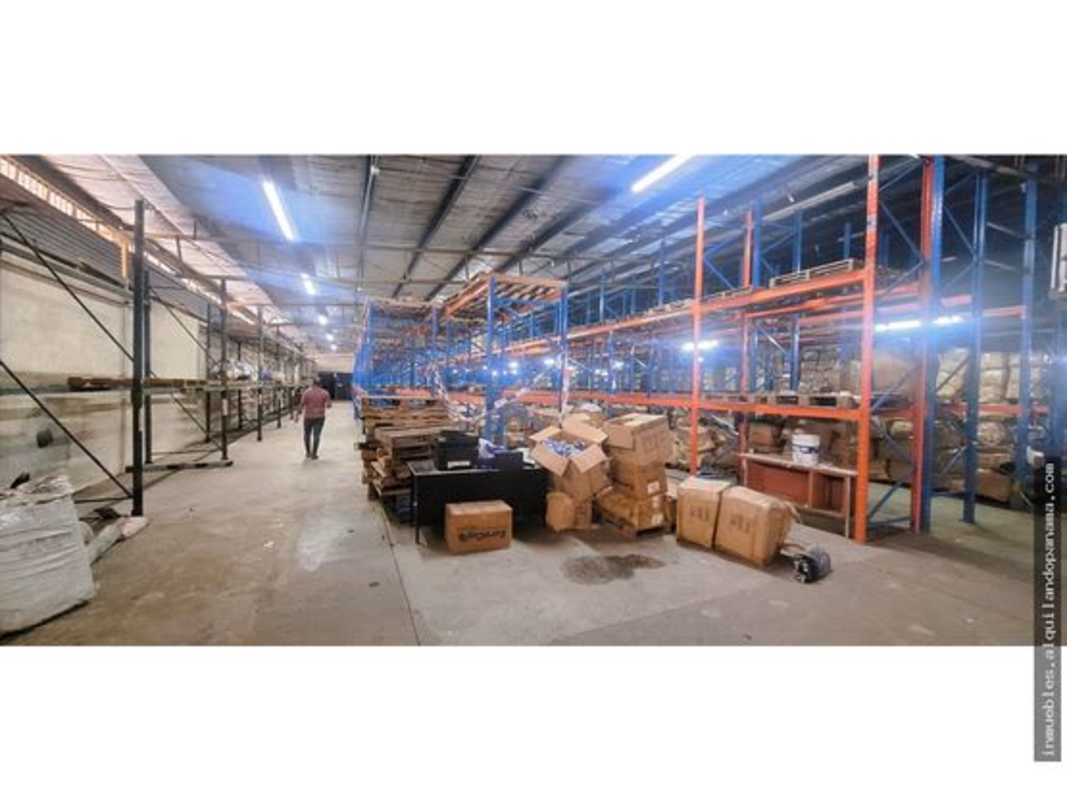 View of warehouse exterior with loading dock and parking area La Loceria Betania Panama City