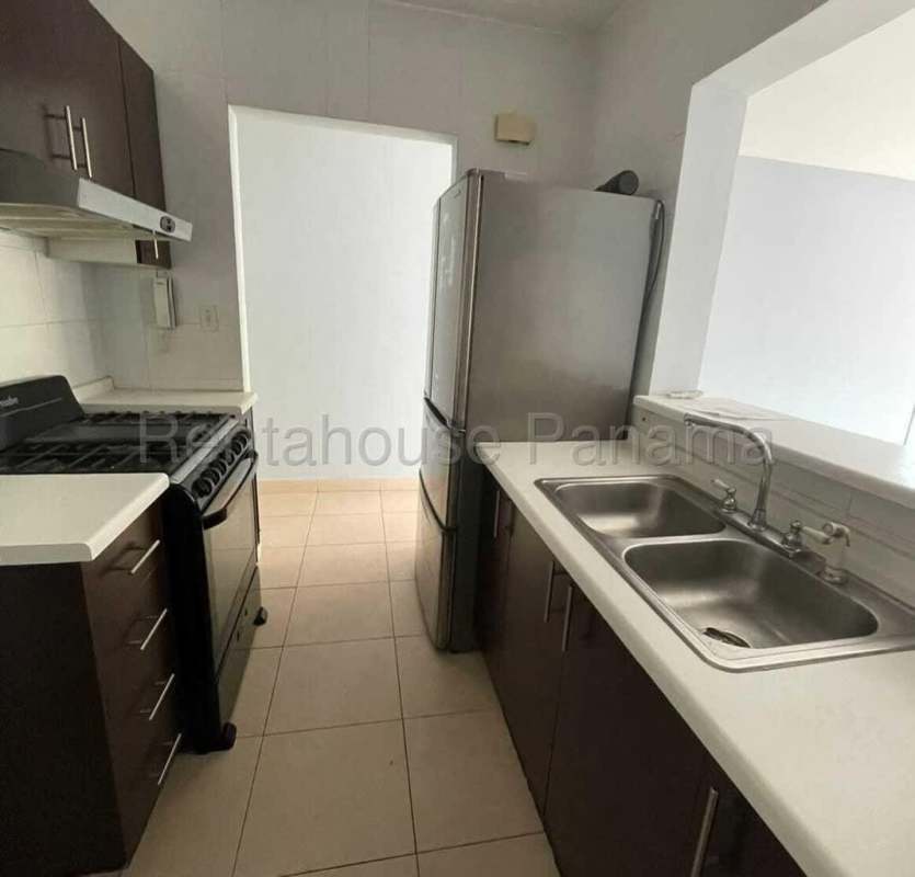 Modern kitchen with stainless steel fridge stove and cabinets PH Vivendi Towers Edison Park Panama