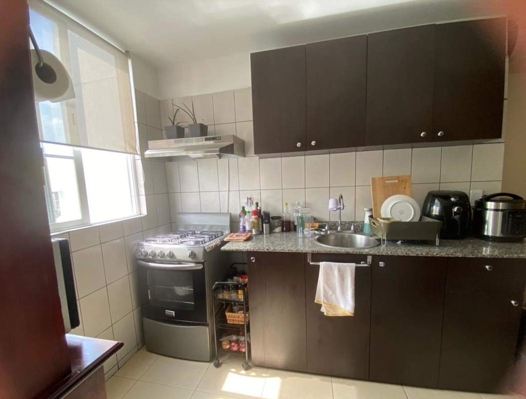 Spacious master bedroom with built-in closet, window, and city view at PH Mystic Hills.