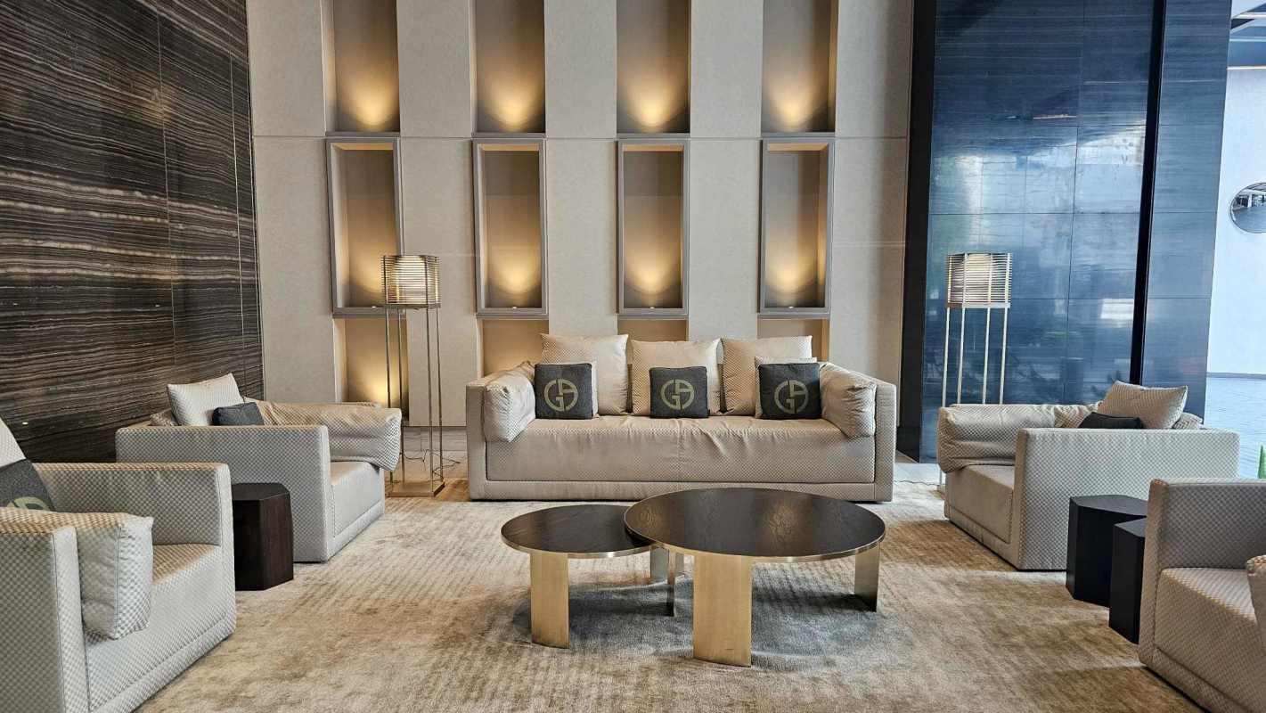 Contemporary kitchen with minimalist cabinetry and marble accents at Nuovo by Armani Panama City