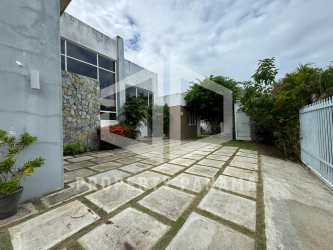 Spacious bathroom with double vanity, glass shower, neutral tones in Coronado beach house Panama