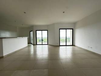 Bright master bedroom with large windows offering Pacific Ocean views PH Las Olas Playa Blanca Panama