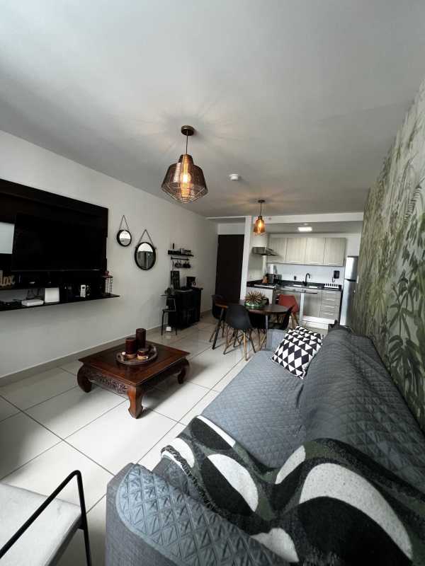 Modern open-plan living and dining area with wall accents in PH Mi Condado Panama