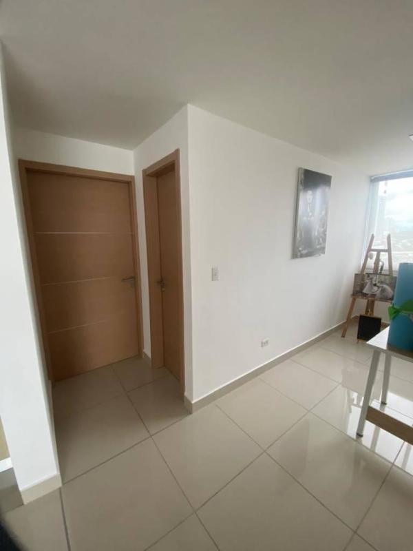 Contemporary kitchen with breakfast bar and appliances in PH Torres de Castilla Panama