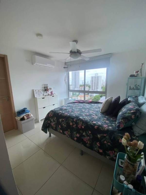 Bedroom with closet space and city view in PH Torres de Castilla Panama City