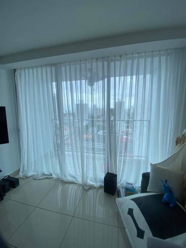 Bright living dining with panoramic windows city skyline views in PH Torres de Castilla Panama