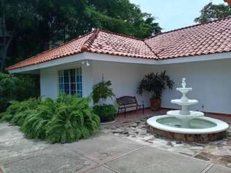 Mediterranean inspired beach house with fountain and lush gardens in Coronado Panama